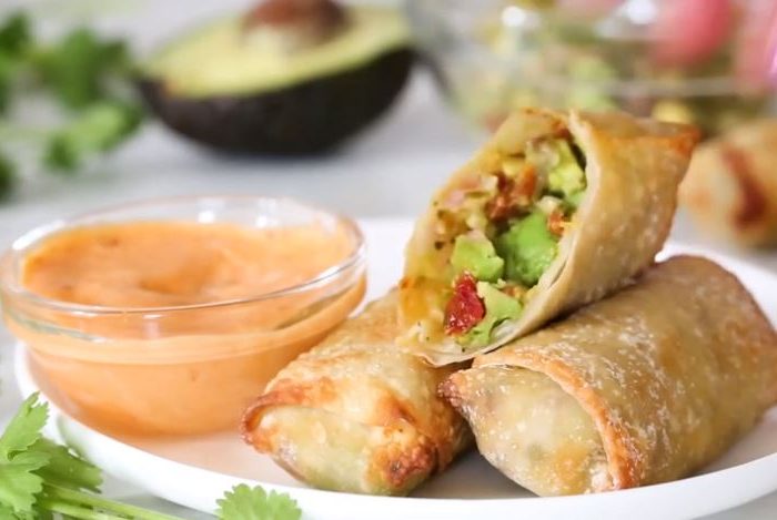 Looking for the perfect healthy appetizer? Picture avocado egg rolls served with a delicious sweet chili sauce, that makes one heck of a tasty bite.