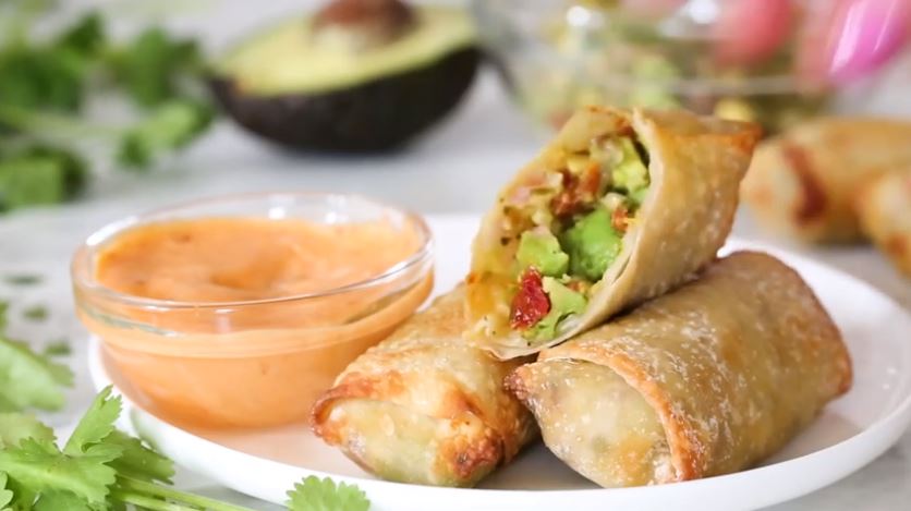 Looking for the perfect healthy appetizer? Picture avocado egg rolls served with a delicious sweet chili sauce, that makes one heck of a tasty bite.